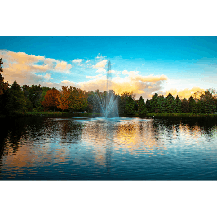 Atriarch Fountain by Scott Aerator operating in a narrow wooded pond with green banks