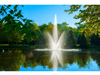 Atriarch Fountain by Scott Aerator spraying in a calm pond surrounded by green trees
