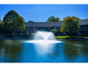 Brand Scott Aerator DA-20 display aerator operating in apartment community retention pond