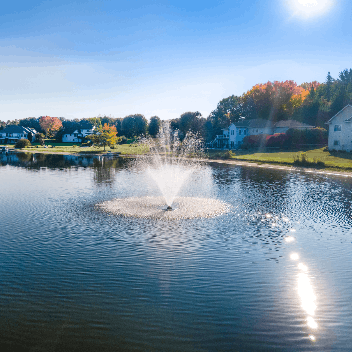 Bright lakeside view of the Scott Aerator Cambridge fountain in operation