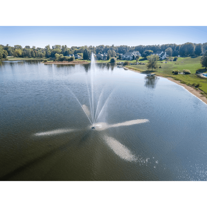 Clover Pond Fountain by Scott Aerator spraying across a large residential lake