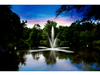 Clover display fountain by Scott Aerator creating a glowing evening spray pattern