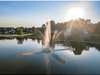 Clover fountain by Scott Aerator running in a neighborhood lake at sunset