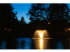 Display aerator DA-20 from Scott Aerator lit up on pond after dark