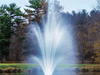 Front view of the Scott Aerator Amherst Pond Fountain creating a tall three-tier display in a pond