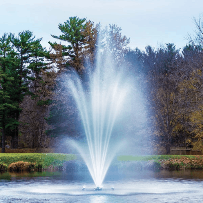 Front view of the Scott Aerator Amherst Pond Fountain creating a tall three-tier display in a pond