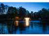 North Star aerating pond fountain by Scott Aerator illuminated with white LED lights at dusk