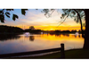 North Star aerating pond fountain from Scott Aerator shown across lake at sunset