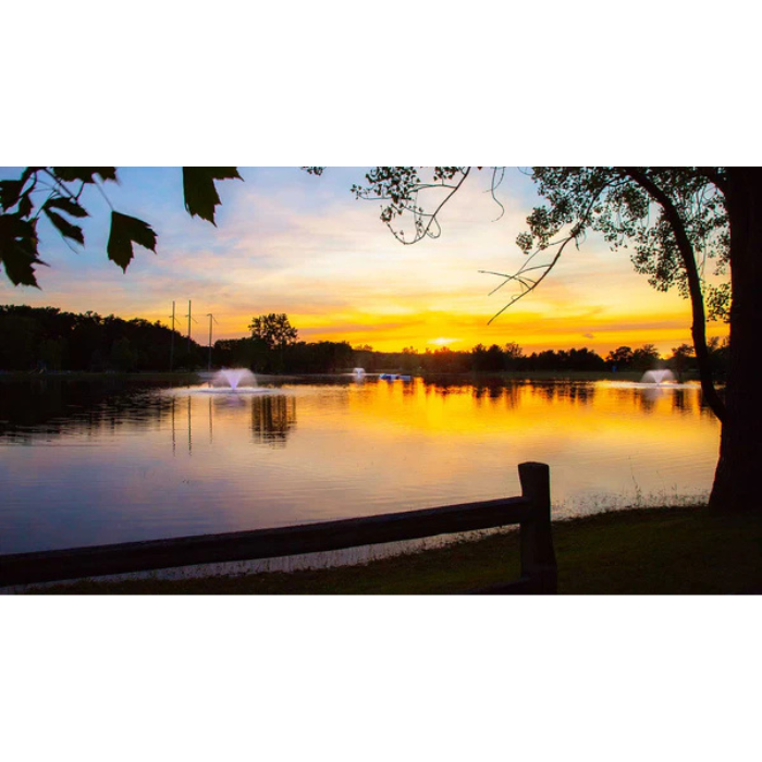 North Star aerating pond fountain from Scott Aerator shown across lake at sunset