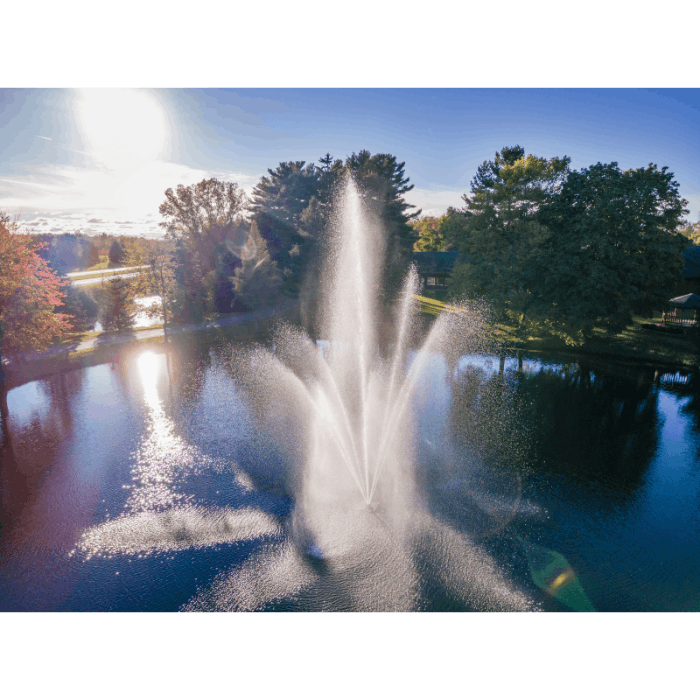 Scott Aerator Atriarch fountain captured from above with bright sunlight and wide spray pattern