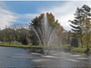 Scott Aerator Atriarch fountain with nine-stream spray pattern in a roadside pond