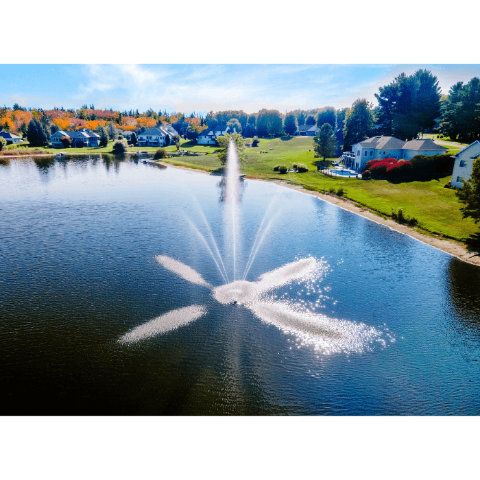 Scott Aerator Clover fountain creating a bright multi-stream display in a neighborhood pond