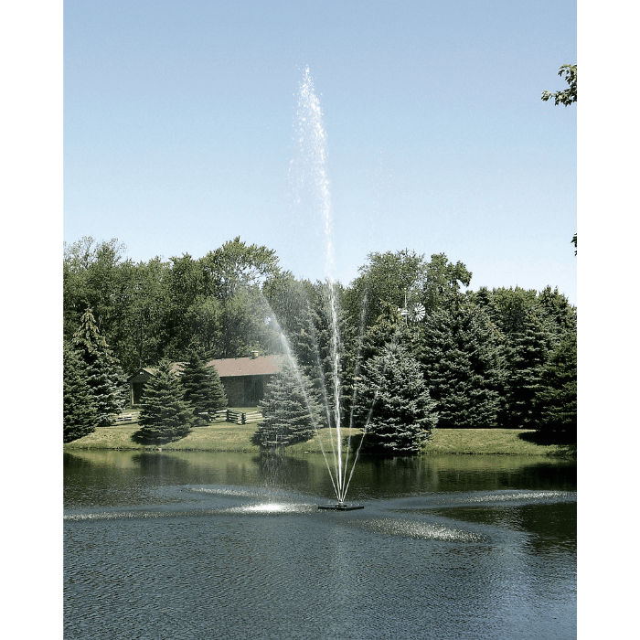 Scott Aerator Clover fountain with tall center plume in a wooded pond