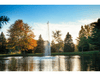 Scott Aerator Gusher fountain operating in a pond with autumn trees and soft evening light
