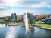 Scott Aerator Gusher fountain spraying in a residential lake with shoreline homes in view