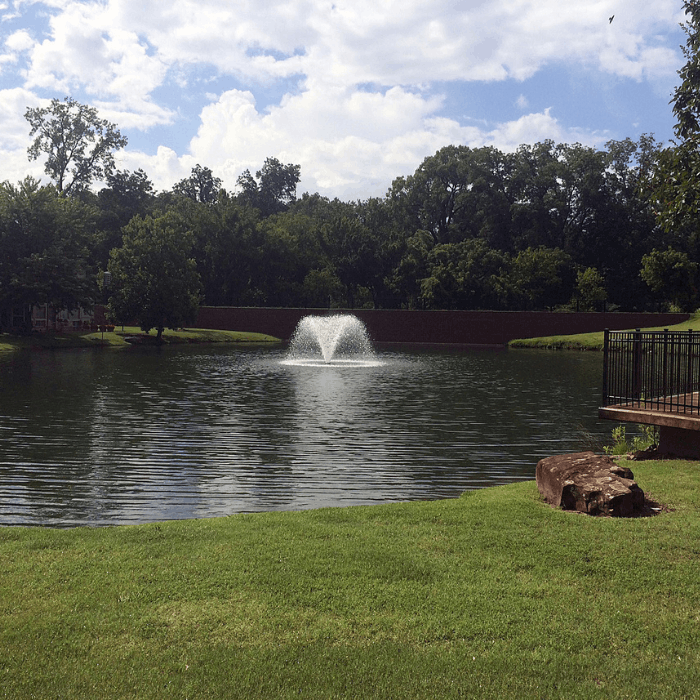 Scott Aerator North Star aerating pond fountain operating in landscaped residential pond