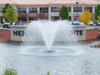 Scott Aerator North Star pond fountain installed in commercial entry pond with aerating spray pattern