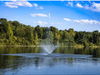 Scott Aerator Skyward fountain creating a tall center plume on a bright blue-sky day