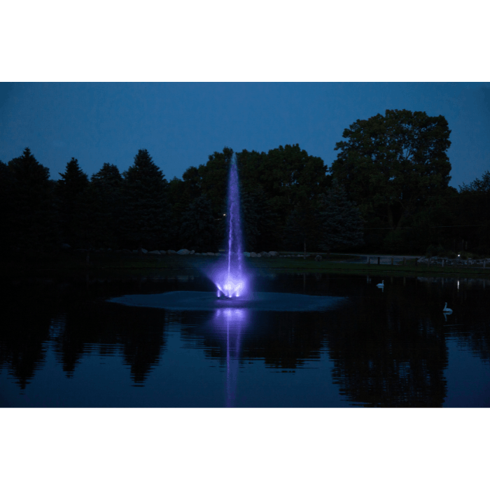 Scott Aerator Skyward fountain with purple lighting in a still evening pond