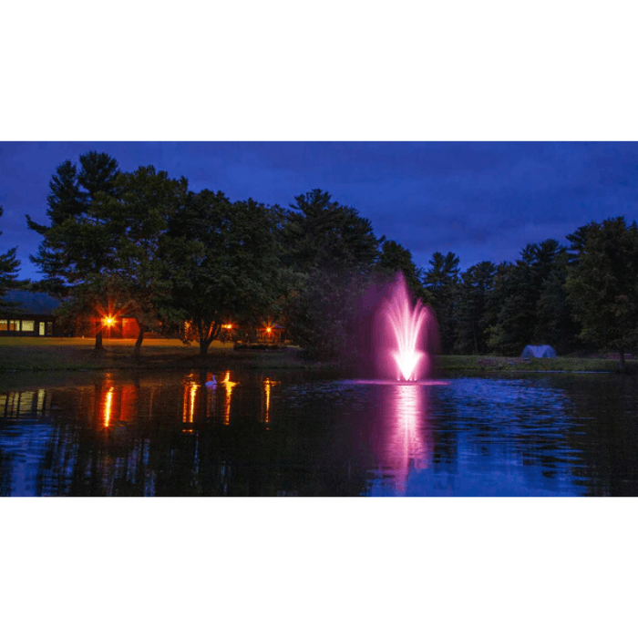 Scott Aerator color-changing LED light set for fountains illuminating pond fountain in pink at night