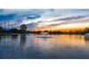 Scott Aerator color-changing LED light sets for fountains glowing on pond at sunset