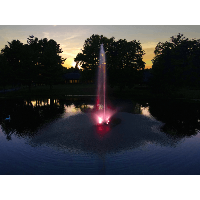 Skyward fountain by Scott Aerator running in a residential pond at golden hour