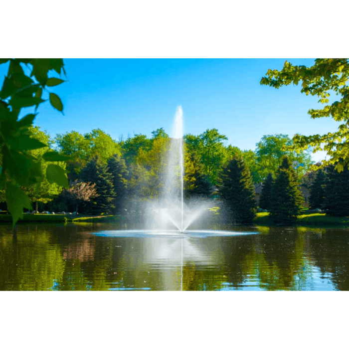 Skyward fountain by Scott Aerator spraying in a calm pond bordered by trees