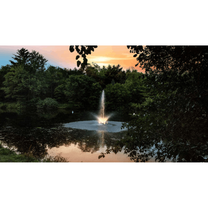 White LED light set for fountains by Scott Aerator highlighting pond fountain after dark