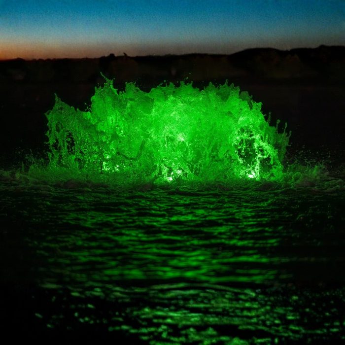 Kasco Aerator with green LED lighting illuminating pond water