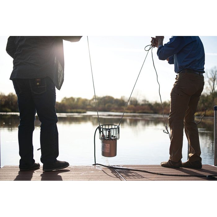 Kasco De-Icer Unit on Sling Holding By Two Men
