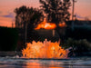 Kasco Surface Aerator with orange LED lighting reflecting on water at sunset