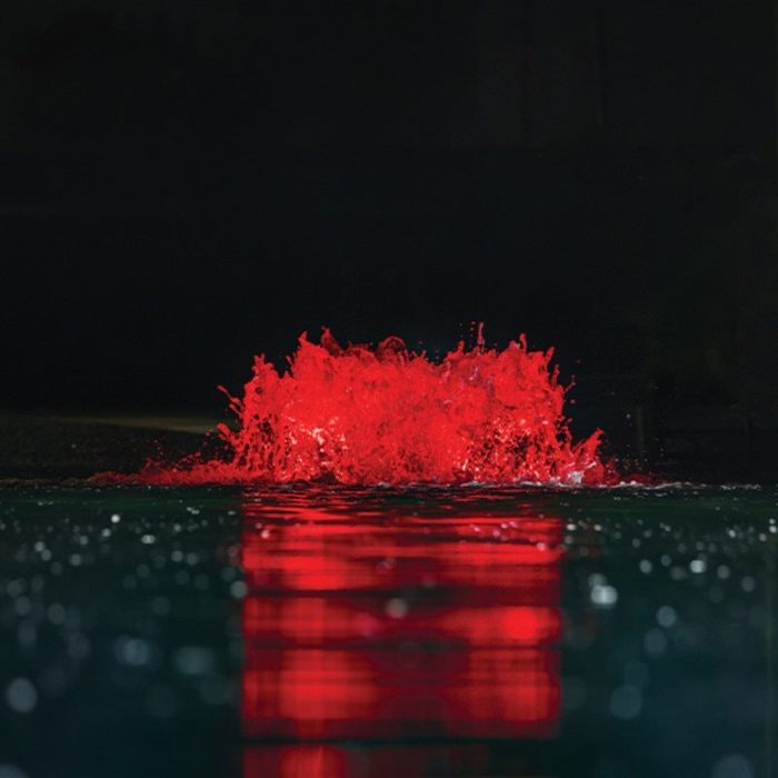 Kasco Surface Aerator with red LED lighting glowing on pond surface