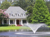 Kasco VFX creating a wide spray pattern in a landscaped pond at a residential home