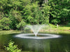 Kasco VFX Series operating in a natural pond surrounded by dense green trees
