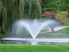Kasco VFX Series with the V-spray pattern in front of green trees and grass