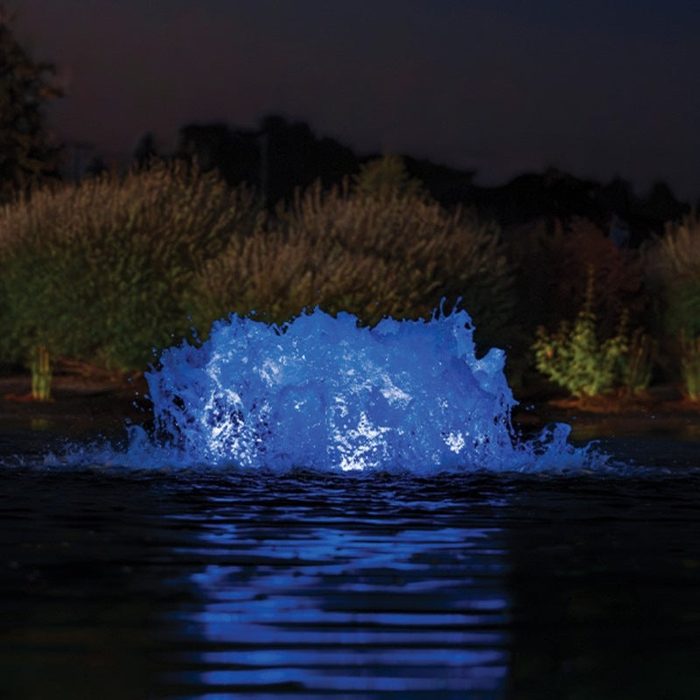 Kasco with blue LED lighting illuminating pond water at night