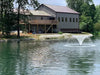 Vanguard Typhoon 3/4 HP Floating Display Aerator On Water Display with House at the Background