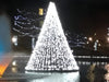 Floating Christmas Tree with White LED Lights in pond close up