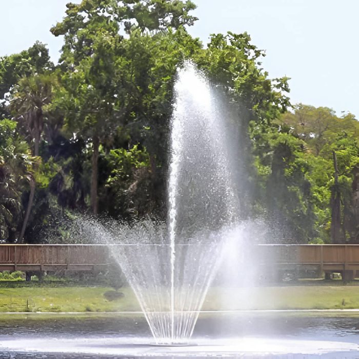 Vertex RingJet Floating Fountain Series On Water with Trees at the Background