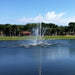 Vertex TriTier Floating Fountain Series On Blue Water with Trees at the Background