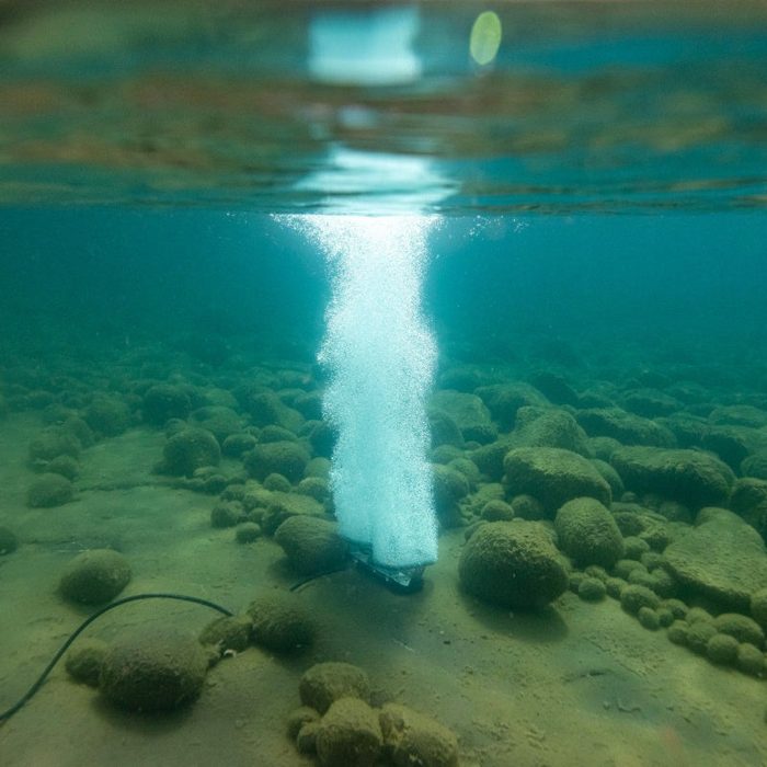 Robust-Aire diffused aeration system producing vertical bubble plume from lake bottom diffuser