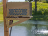 Robust-Aire Small Cabinet with Post Mount Bracket on a wooden stand by a pond