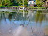Scott Aerator AquaSweep Max mounted on a tripod in a lake clearing muck off the bottom