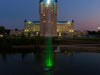 Scott Aerator Jet Stream Pond Fountain with green LED lights illuminated at night