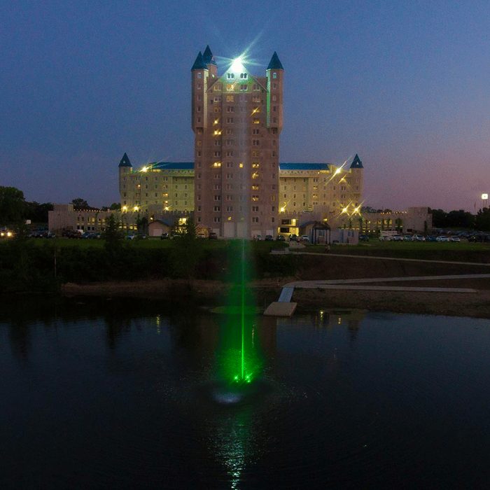 Scott Aerator Jet Stream Pond Fountain with green LED lights illuminated at night