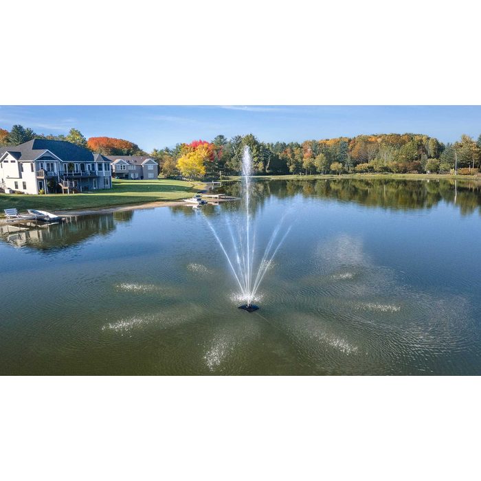 Scott Aerator Solar Atriarch Fountain in a fishing lake with houses in the background