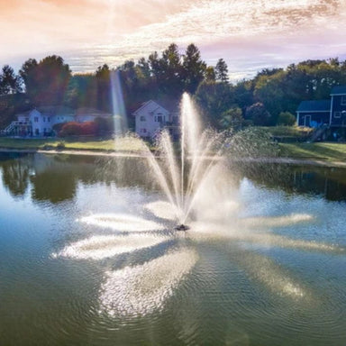 Scott Aerator Solar Atriarch Fountain in a pond with houses and trees