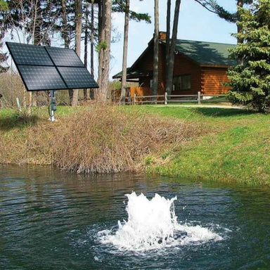 Scott Aerator Solar Boilermaker 3/4 HP running with four panels beside a house