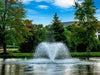 Scott Aerator DA-20 display aerator on water with blue sky and trees