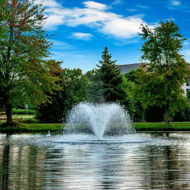 Scott Aerator DA-20 display aerator on water with blue sky and trees